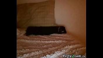 Brunette with glasses puts a dildo depply in her pussy