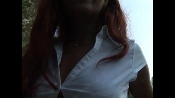Little redhead whore shows off her pussy and boobs in a park