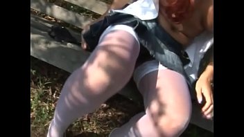 Little redhead whore shows off her pussy and boobs in a park