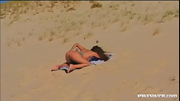 Vayana masturbates and gets ass fucked while lying on the beach