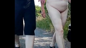 Outdoor striptease with naked granny