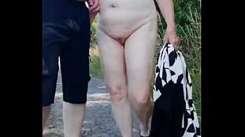 Outdoor striptease with naked granny