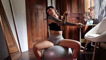 Stretching in my room with short yoga panths i got horny and i wet my yoga pants then i play with my ass fiengering and puting my butt plug