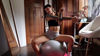 Stretching in my room with short yoga panths i got horny and i wet my yoga pants then i play with my ass fiengering and puting my butt plug