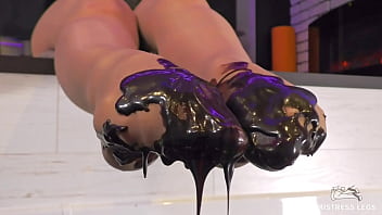 Goddess messy her nylon feet in chocolate close up and squeezing strawberries