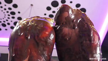Goddess messy her nylon feet in chocolate close up and squeezing strawberries